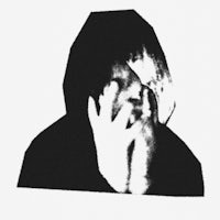 a black and white image of a person covering their face